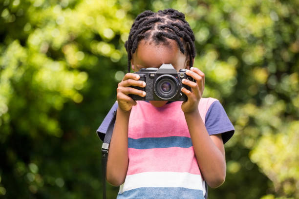 istock A child is taking picture with camera 660319150