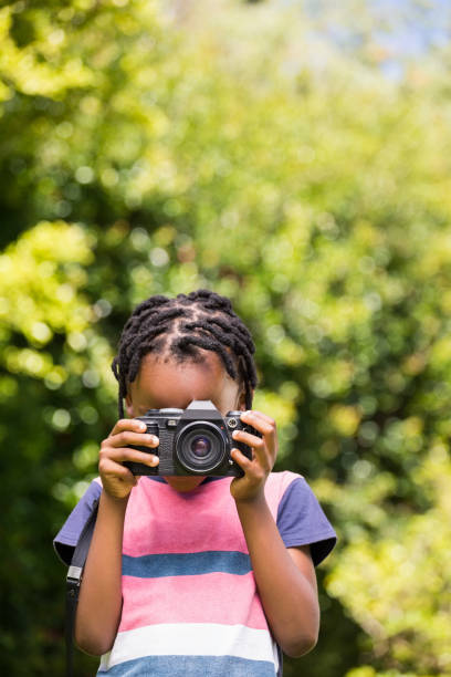 istock A child is taking picture with camera 660319188