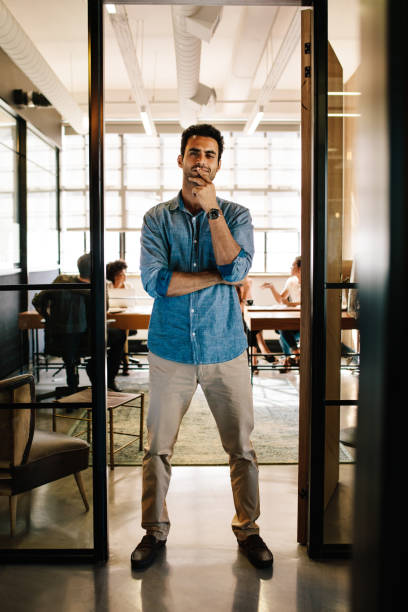 istock Creative young man standing in doorway 660322110