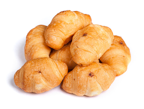 Heap of small croissant isolated on white