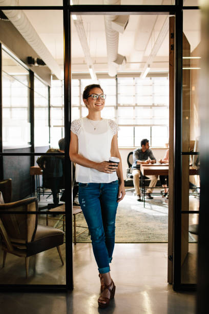 istock Woman having coffee break at startup 660325178