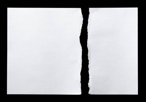 istock White torn of paper isolated on a black background. 660329212