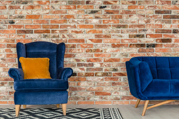 istock Mustard pillow on blue armchair 660332776