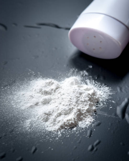 istock Spilled baby scented powder on a black slate,Selective focus 660332852