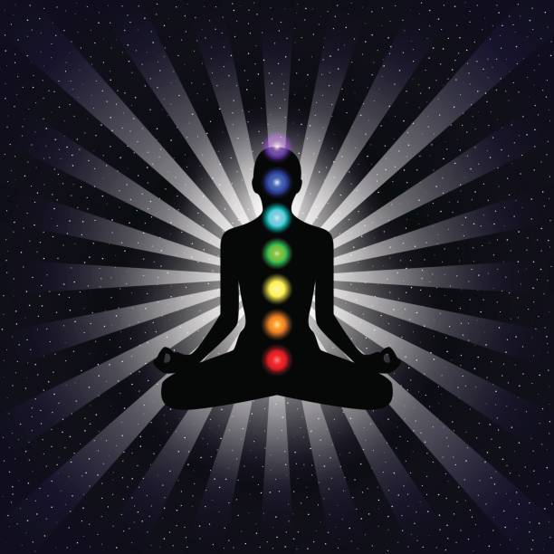 istock Vector meditation design concept. Silhouette in lotus position with seven chakras over night sky background. 660334188