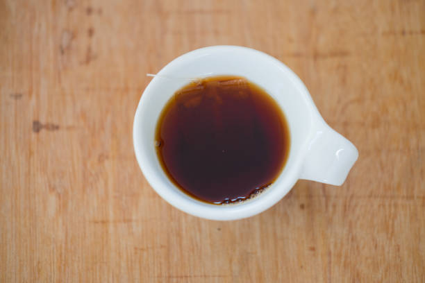 istock Hot tea in cup on wood table, top view 660340760