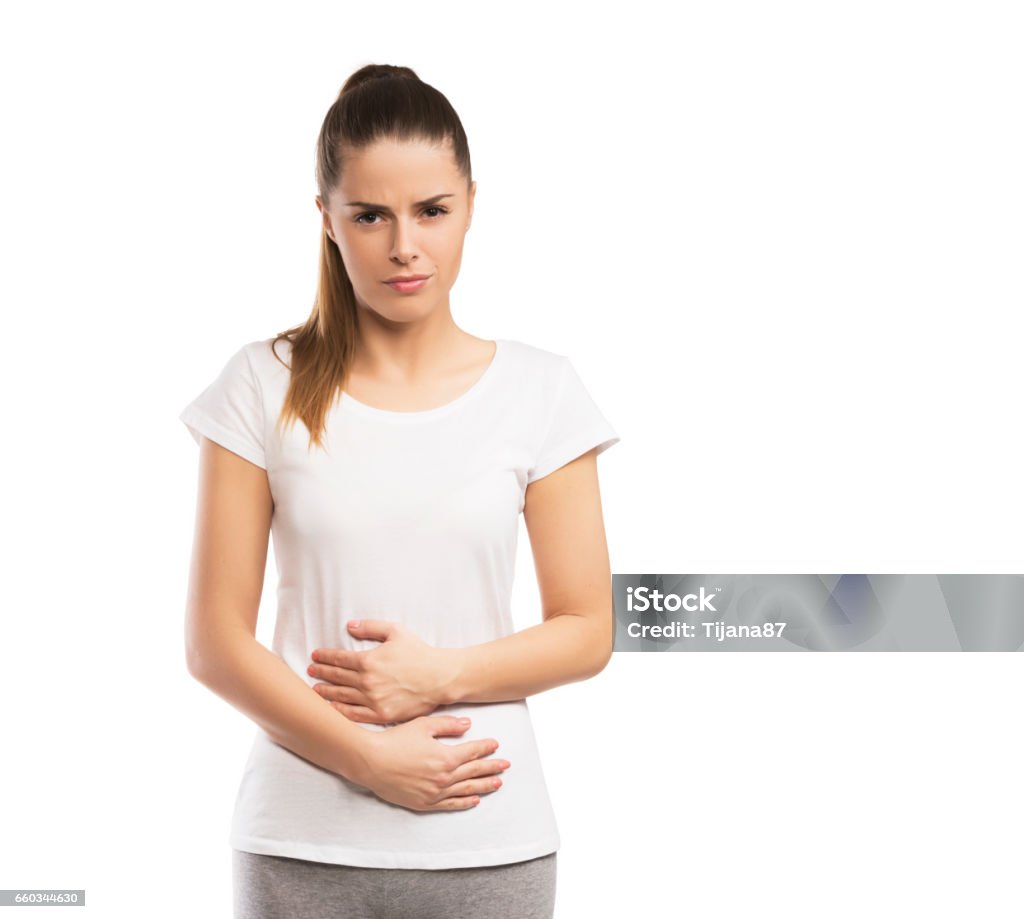 Woman having abdominal pain isolated on white Stomachache Stock Photo