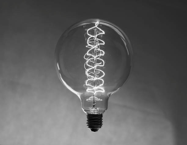 istock light bulb suspended by two stripped wires and then inverted. 660348208