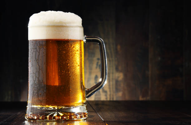 istock Composition with glass of beer on wooden background 660351268