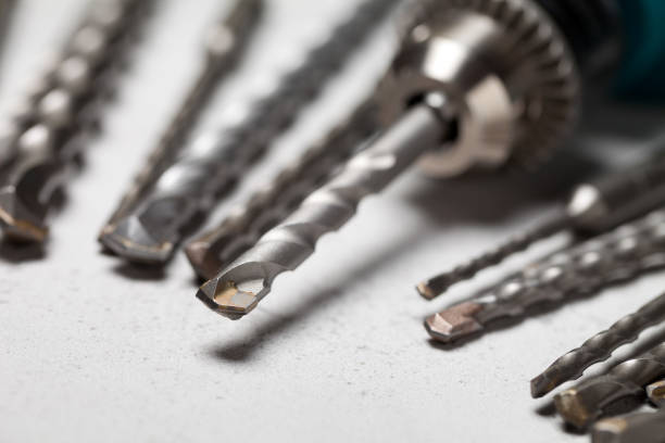 istock Close up of drill bits on concrete background 660351972