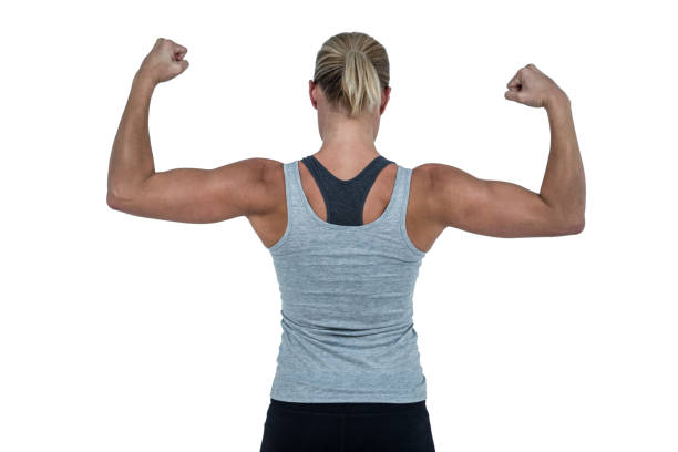 istock Rear view of muscular woman flexing muscles 660352736