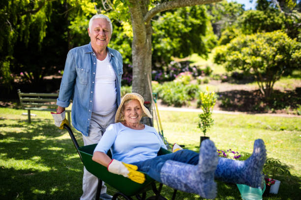istock Senior couple playing with a wheelbarrow 660356190