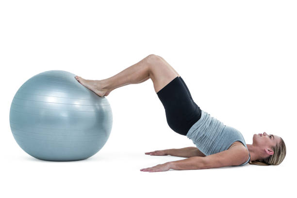 istock Muscular woman lying on floor with legs 660356940