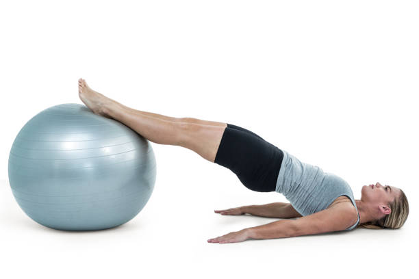 istock Muscular woman lying on floor with legs 660356984