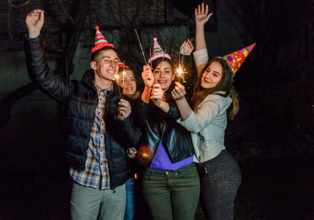 istock Sparklers in the hands for birthday party 660357106