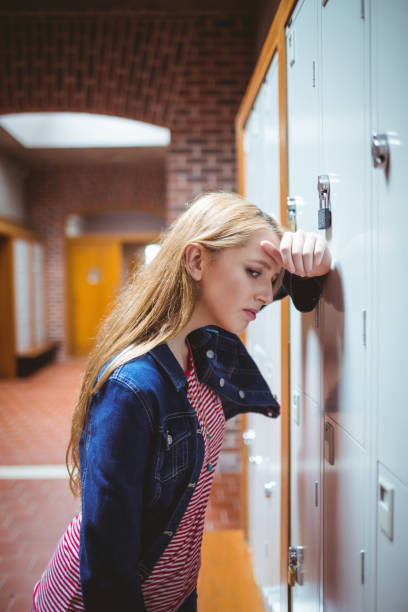 istock Worried leaning against the locker 660357172