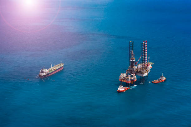 Offshore oil rig platform in the gulf from aerial view. Offshore oil rig platform in the gulf from aerial view.Offshore oil rig platform in the gulf from aerial view.Offshore oil rig platform in the gulf from aerial view. military tanker airplane photos stock pictures, royalty-free photos & images