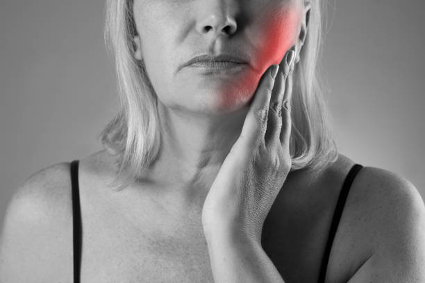 istock Aged woman with toothache, teeth pain closeup 660363120