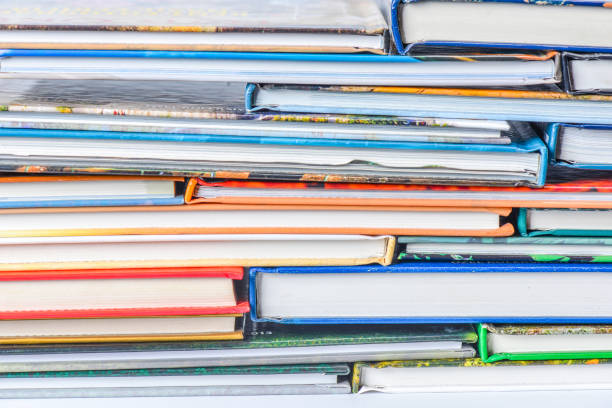 istock High angle view of many hardback books. Library or school 660366024