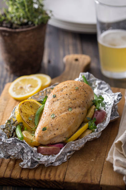 istock Grilled Chicken with Vegetables in Foil Pouch 660374118