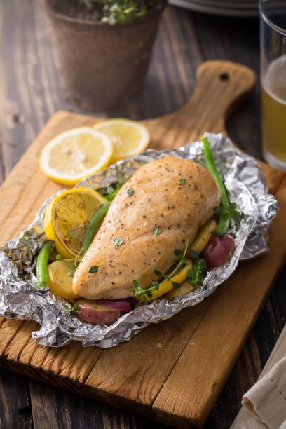 istock Grilled Chicken with Vegetables in Foil Pouch 660374690