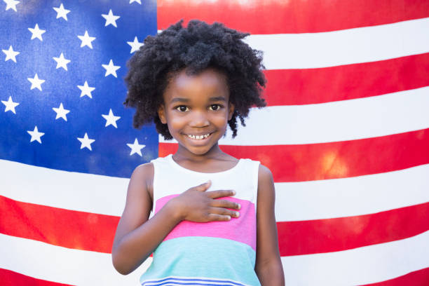 istock A little girl is touching her heart 660378666