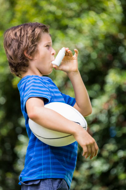 istock A little boy is breathing an asthma medication 660383718