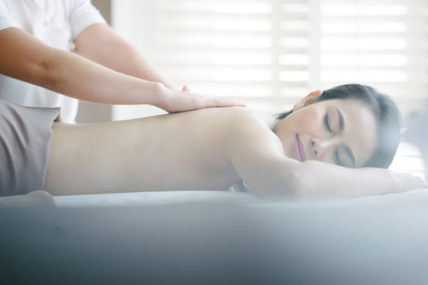 istock Young woman enjoying oil massage 660384166