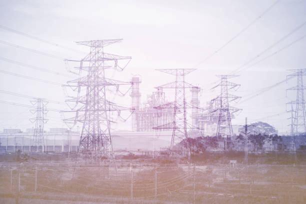 istock Double exposure high voltage pole and power plant background 660385590
