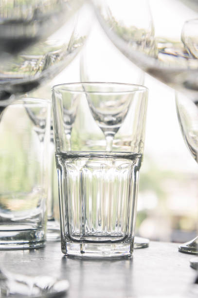 istock water glass on the shelves , Drinking water container, Empty water glass 660385642