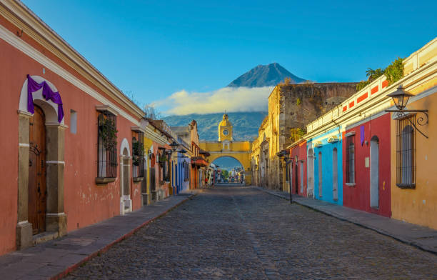 Antigua City at Sunrise The historic city of Antigua at sunrise with a view over the main street and the Catalina arch and the Agua volcano in the background, Guatemala. guatemala landscape stock pictures, royalty-free photos & images