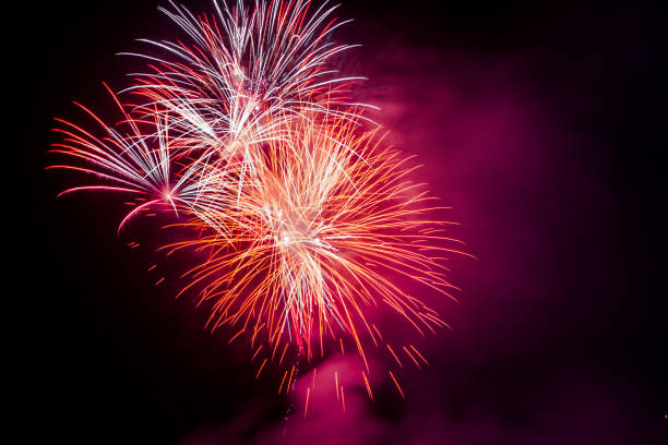 istock Brightly colorful fireworks in the night sky 660390778