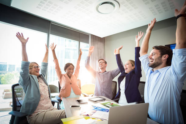 istock Business people raising their arms 660390980