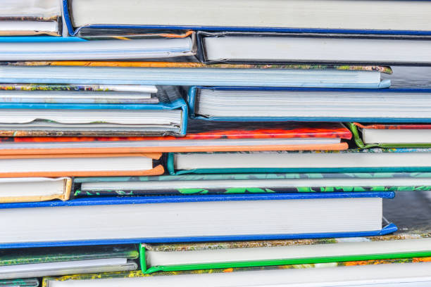 istock High angle view of many hardback books. Library or school 660391042