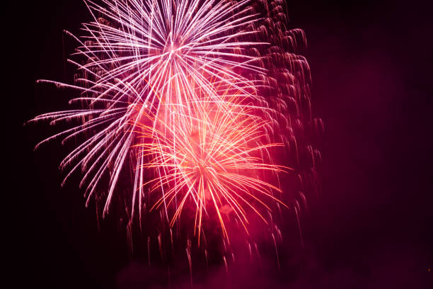 istock Brightly colorful fireworks in the night sky 660391138