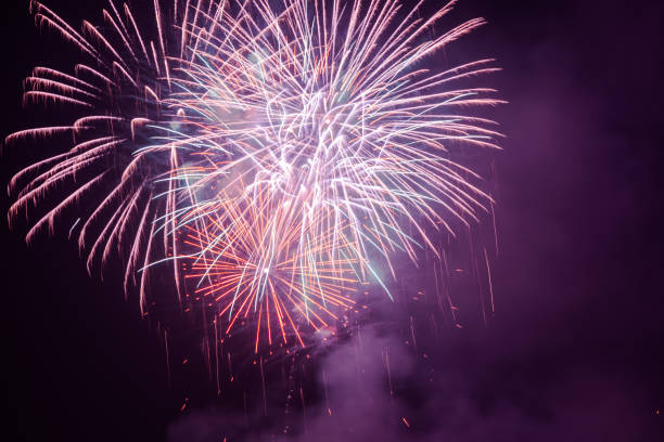 istock Brightly colorful fireworks in the night sky 660391264