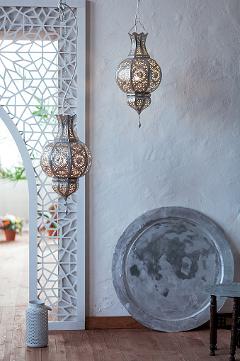 Selective focus point on Morocco light lantern decoration in living room interior - Vintage Light Filter.