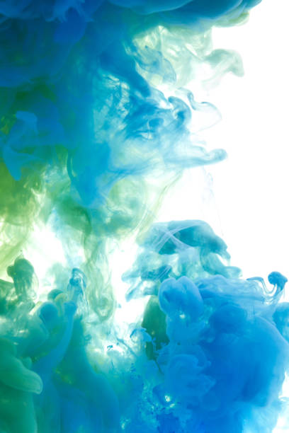 istock Colors dropped into liquid and photographed while in motion. Ink swirling in water. Cloud of silky ink in water isolated on white background. Colorful ink in water, an abstract banner. 660398708