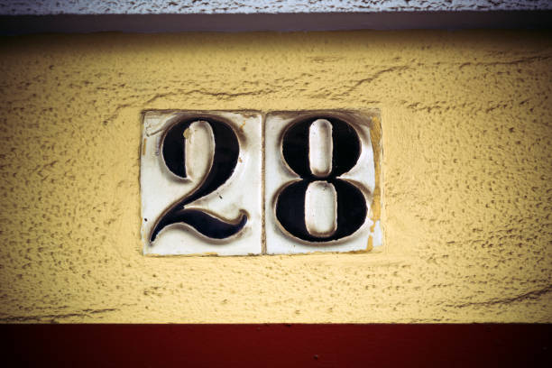 istock Number twenty eight in raised figures on plaster wall 660399186