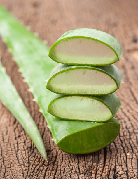 istock Aloe vera sliced on wooden background 660409136