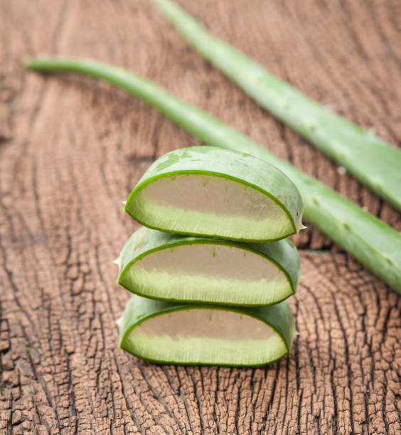 istock Aloe vera sliced on wooden background 660409522