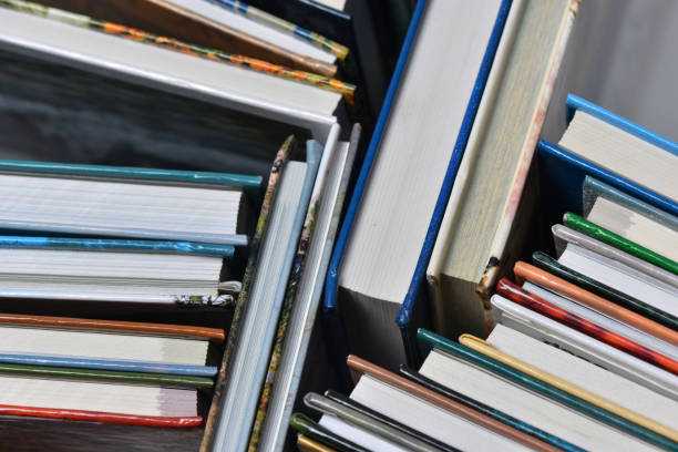 istock High angle view of many hardback books. Library or school 660414802