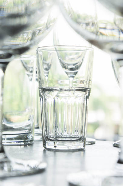 istock water glass on the shelves , Drinking water container, Empty water glass 660415166