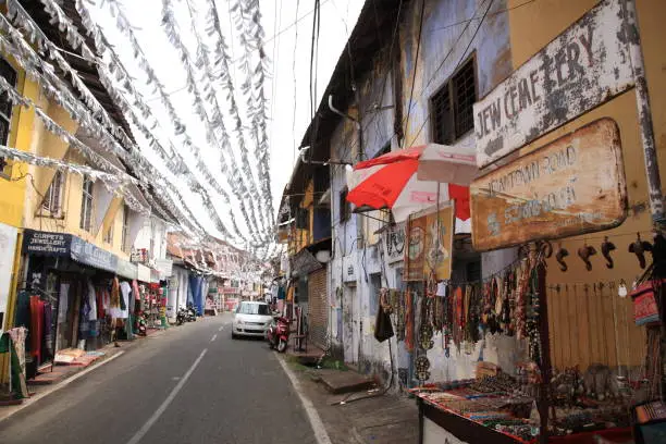 Jew town in Mattancherry, Kochi, Kerala, India. Jew Town in Mattancherry is famous for the antique shops and colonial buildings. Jew Town is a narrow street between Mattancherry Palace and the Synagogue.