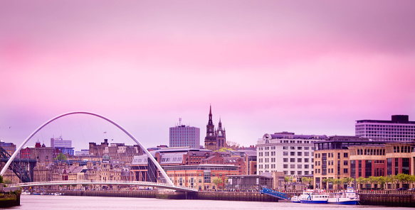 vivid pink and mauve sky over the millennium bridge and Newcastle-upon-Tyne skyline