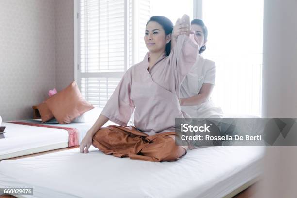 Traditional Thai Massage Stock Photo - Download Image Now - 20-29 Years, 30-34 Years, 30-39 Years