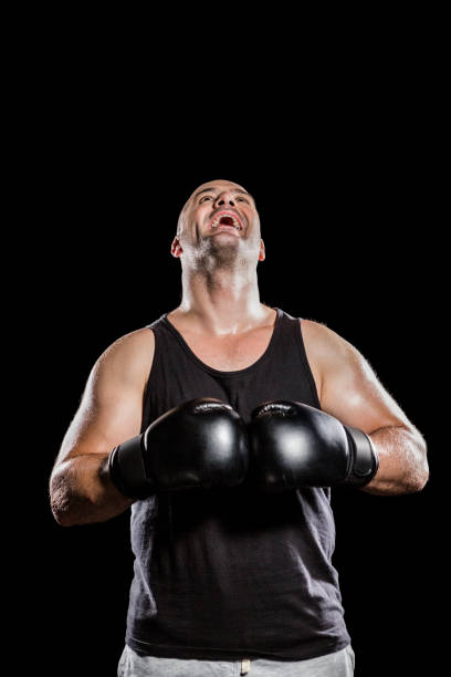 istock Boxer in boxing gloves laughing 660429312