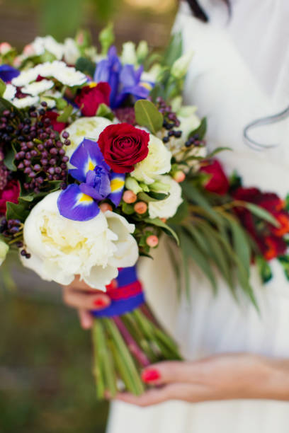 istock Beautiful bouquet in bride's hands 660429316