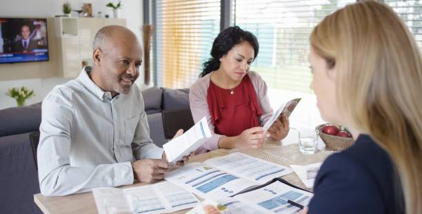 istock Insurance agent discussing with couple 660429676