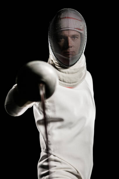 istock Man wearing fencing suit practicing with sword 660434342